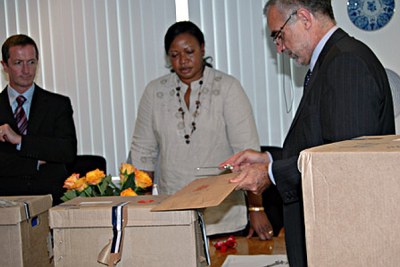 Mr Luis Moreno-Ocampo studies the list of Kenyan suspects at the International Criminal Court headquarters with the prosecutor-designate, Ms Fatou Bensouda from The Gambia.