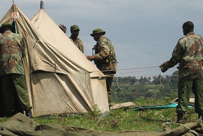 Forest rangers prepare to relocate Mau Forest settlers in Kenya.