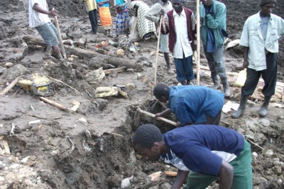 Residents dig through the rubble in the hope of finding survivors.