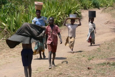 Children hauling water in Malawi.