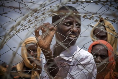 Newly arrived refugees from Somalia wait to be registered at Dagehaley camp, one of three camps that make up the Dadaab refugee camp in north eastern Kenya.