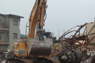 Bulldozers clear the rackege of the Dana plane