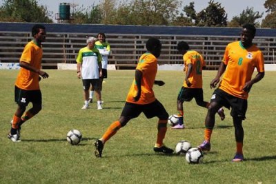 Zambia's Collins Mbesuma and his team mates.