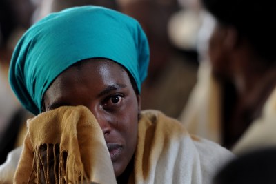 A woman cries at a memorial service for slain miners in Marikana.
