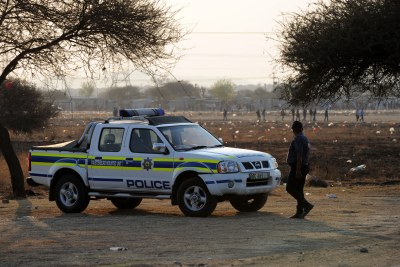 File photo: A policeman keeps an eye on striking miners.