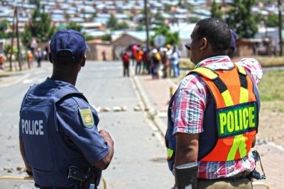 A tense stand-off between police and protestors in Robertson after farmwokers protest turned violent