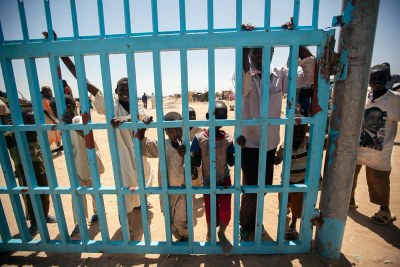 Displaced children stand at the UNAMID compound in Saraf Omra, North Darfur.