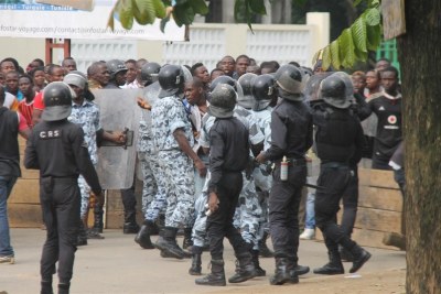 Ivoirian security forces restrain a crowd during previous protest action.