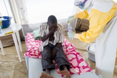 Treating an Ebola patient.