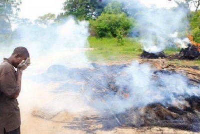 A Villager cries after losing everything during evictions in Mazowe.