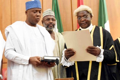 Abubakar Bukola Saraki taking the oath of office as Senate President