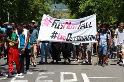 University of Cape Town (UCT) Students watch as protesters march to different parts of the campus during a university shut down.