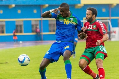 Amavubi forward Ernest Sugira, shields the ball from Morocco defender Issam Erraki on Sunday. Rwanda lost the game 4-1.
