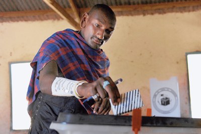 A voter cast a vote during the Tanzanian election.