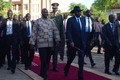 President Salva Kiir, right, wearing hat,  and Riek Machar, left (file photo).