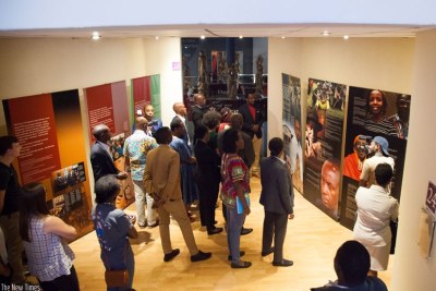 Visitors read messages on the Genocide at Kigali Genocide Memorial Centre (file photo).