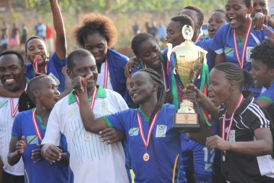 Tanzania women celebrate with the trophy after victory over Kenya gave them the regional title.