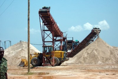 Machines excavate sand from one of the mining fields in Lwera wetland on Masaka Road. (file photo).