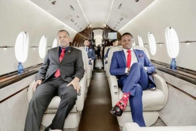 Shepherd Bushiri (right) in his new private jet on his day long trip to Malawi for a worship service.