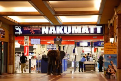 A customer walks into one of the branches of Nakumatt Supermarket in Kampala.