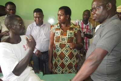MPs and officials listen to one of the victims at St Mary’s hospital Lacor.