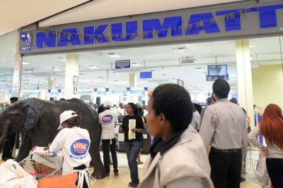 Shoppers enter Nakumatt supermarket in Garden City Mall in Nairobi.