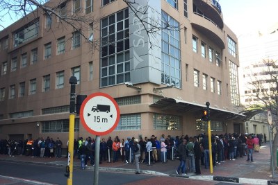 Hundreds of people wait in a queue outside the South African Revenue Service (SARS) office in Cape Town (file photo).