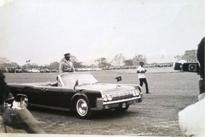 Idi Amin arrives at Kololo Independence grounds in an open American Chevrolet to be sworn in as president.