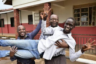 Ecam Robin Opungu and his teachers after he scored Aggregate 9 from Luyanzi College in Bweyogerere in Wakiso District, in last year’s UCE.