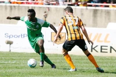 Gor Mahia forward Ephraim Guikan attempts to go past Hull City’s Robbie Mackenzie during an international friendly match at the Moi Sports Centre Kasarani in Nairobi on May 13, 2018.