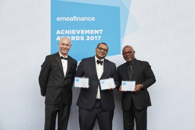 Andrew Alli (center) and Oliver Andrews (right) receive Champion of Finance Award from Christopher Moore, CEO and Publisher of EMEA Finance.