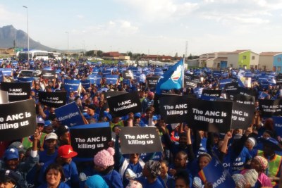 Democratic Alliance supporters bear signs saying 'The ANC is Killing Us' at the #SendTheArmyNow march in Cape Town.