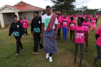 Toronto Raptors president Masai Ujiri with the girls at the Samburu Girls Foundation during his visit on August 19, 2018.