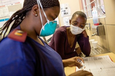 Simbongile Xesha collects her medication from the pharmacy at Town 2 Clinic, Kuyasa, Khayelitsha.