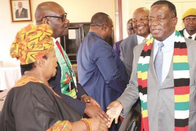 President Emmerson Mnangagwa greets David Parirenyatwa and Cleveria Chizema on arrival at a Politburo meeting in Harare on October 25, 2018.