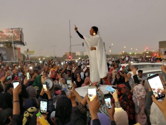 In an influential image of African protests for peace and democracy, captured by Lana H. Haroun, 22-year-old Sudanese architectural engineering student Alaa Salah (@oalaa_salah) chanted poetry from the top of a car.