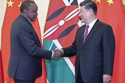 President Uhuru Kenyatta (left) greets Chinese President Xi Jinping at the Great Hall of the People in Beijing on April 25, 2019 ahead of the second Belt and Road Forum for International Cooperation.