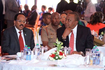 Presidents Mohamed Abdullahi Mohamed Farmaajo of Somalia and Kenya's Uhuru Kenyatta at a national prayer breakfast (file photo).