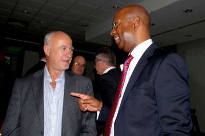 Safaricom's founding chief executive Michael Joseph (left) with the late Bob Collymore who succeeded him at the telecom giant (file photo).