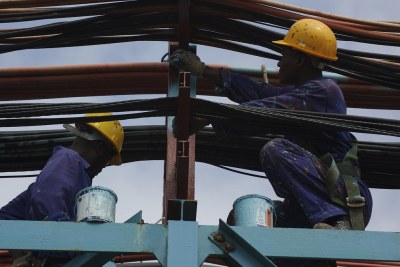 Workers maintain the thermal power station at Takoradi, Ghana (file photo).