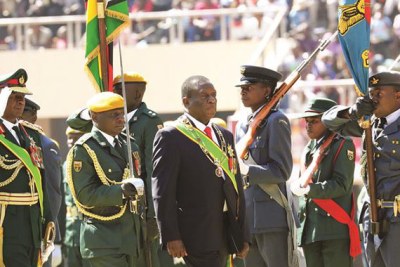 President Emmerson Mnangagwa and Commander of the Zimbabwe Defence Forces General Phillip Valerio Sibanda inspect a parade during Zimbabwe Defence Forces Day celebrations (file photo).