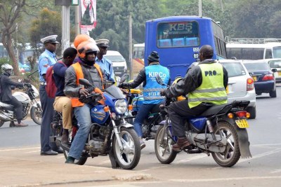 Boda Boda riders turn a roundabout to pick and drop passengers along Kenyatta Avenue in Nairobi.