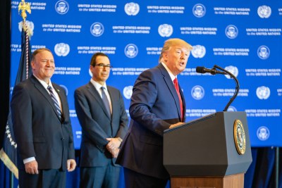 Secretary of State Michael Pompeo, left, watches as President Donald Trump addresses journalists in New York on September 25, 2019 during the 74th Session of the UN General Assembly.