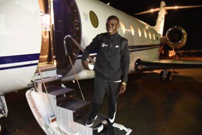 World marathon record holder Eliud Kipchoge boards a private jet at Eldoret International Airport on October 7, 2019 on his way to Vienna, Austria for the “INEOS 1:59 Challenge”.