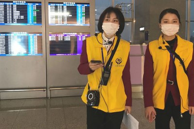 Airport workers wear face masks at China's Chengdu Shuangliu International Airport.