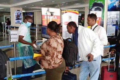 Travellers undergo security checks and coronavirus screening on arrival at Entebbe International Airport on February 6, 2020.