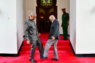 Veteran opposition politician Seif Shariff Hamad from Zanzibar and President John Magufuli greet each other with their feet amid fears of the spread of COVID-19.