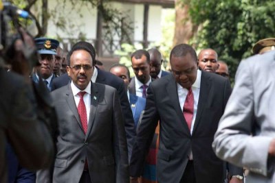 President Uhuru Kenyatta with his Somalia counterpart Mohamed Abdullahi Farmajo after the National Prayer Breakfast at Safari Park Hotel in Nairobi on May 31, 2018.