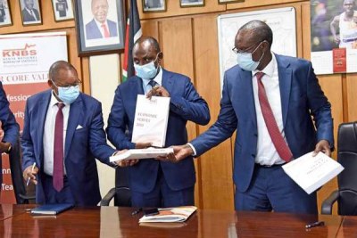 Treasury CS Ukur Yatani (centre) with Kenya National Bureau of Statistics Director-General Zachary Mwangi (right) and State Department for Planning Principal Secretary Saitoti Torome during the launch of the 2020 Economic Survey at the Treasury.