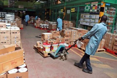 Workers at a paint factory showroom in Industrial Area, Nairobi (file photo).